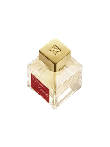 A transparent glass bottle of perfume with a gold cap, featuring "Baccarats Baccarat Rouge 540 Eau de Parfum for Men and Women" in gold and white text on a red background, embodies the essence of an amber floral fragrance.