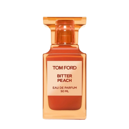 A 100 ml bottle of Baccarats Tom Ford Bitter Peach Eau De Parfum for Men and Women features a warm orange hue that reflects the luxuriant notes of Sicilian blood orange oil and sandalwood absolute, with a square label displaying both the brand and fragrance name.