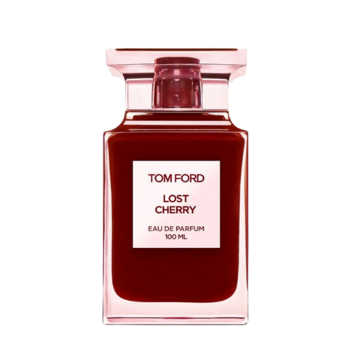 A rectangular, translucent pink bottle with a red liquid inside displays a front label that reads "TOM FORD LOST CHERRY EAU DE PARFUM 100 ML." Infused with the richness of black cherry, the bottle features a square-shaped, translucent pink cap. This unisex fragrance is offered by the brand Baccarats under the name Tom Ford Lost Cherry Eau De Parfum for Men and Women.