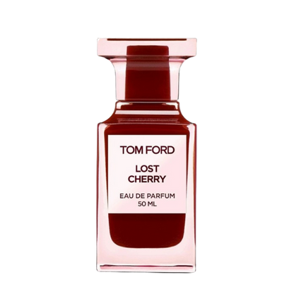 A rectangular, translucent pink bottle with a red liquid inside displays a front label that reads "TOM FORD LOST CHERRY EAU DE PARFUM 100 ML." Infused with the richness of black cherry, the bottle features a square-shaped, translucent pink cap. This unisex fragrance is offered by the brand Baccarats under the name Tom Ford Lost Cherry Eau De Parfum for Men and Women.