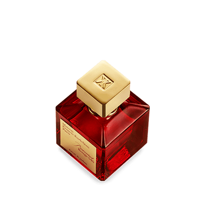 A bottle of Baccarats Baccarat Rouge 540 Extrait de Parfum for Men and Women. The red bottle, with a golden cap and gold label, elegantly showcases the brand name and fragrance details of this exquisite Amber Floral fragrance.