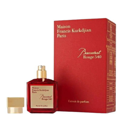 A bottle of Baccarats Baccarat Rouge 540 Extrait de Parfum for Men and Women. The red bottle, with a golden cap and gold label, elegantly showcases the brand name and fragrance details of this exquisite Amber Floral fragrance.