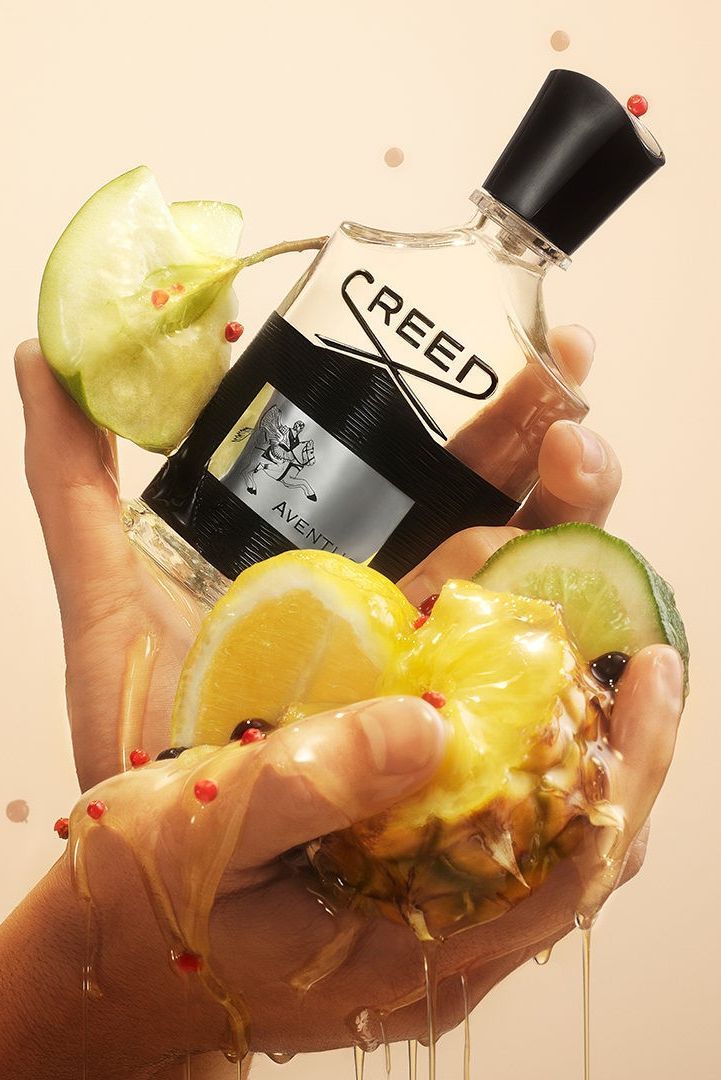 A 100ml bottle of Creed Aventus EDP by Baccarats, with its black cap and label, emphasizes the opulent ambergris notes. The label showcases an intricate design of a horse and rider, while the mostly clear bottle adorned with black accents conveys an aura of sophistication accentuated by Calabrian bergamot.