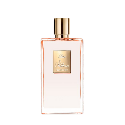 A rectangular glass bottle of By Kilian Love, Don't Be Shy perfume with a gradient pink hue, featuring a gold cap and a square gold label on the front, embossed with the text "Love by Kilian, don't be shy." Infused with delicate notes of Orange Blossom, this Baccarats fragrance captivates from the first spritz.