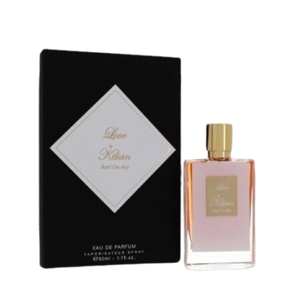 A rectangular glass bottle of By Kilian Love, Don't Be Shy perfume with a gradient pink hue, featuring a gold cap and a square gold label on the front, embossed with the text "Love by Kilian, don't be shy." Infused with delicate notes of Orange Blossom, this Baccarats fragrance captivates from the first spritz.