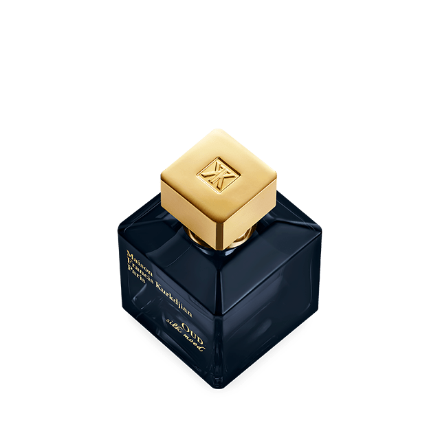 A sleek, rectangular dark blue perfume bottle with a gold cap, labeled "Baccarats OUD Silk Mood Eau de Parfum 70ml" in gold text. This minimalist eau de parfum boasts an elegant design that embodies sophistication.